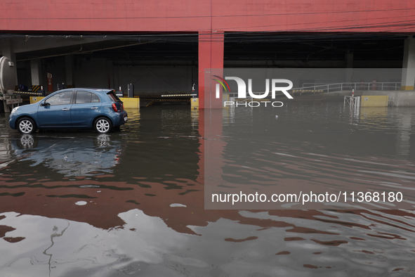 I am viewing the outside of a flooded shopping mall in Ecatepec, State of Mexico, due to the rains during the last few days. 