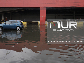 I am viewing the outside of a flooded shopping mall in Ecatepec, State of Mexico, due to the rains during the last few days. (