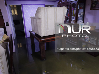 A view inside a house is being affected by flooding in Ecatepec, State of Mexico, as a result of the rains during the last few days. (