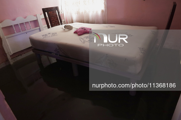 A view inside a house is being affected by flooding in Ecatepec, State of Mexico, as a result of the rains during the last few days. 