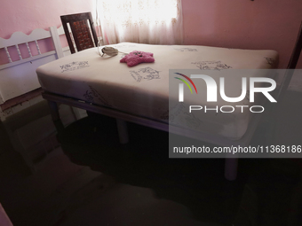 A view inside a house is being affected by flooding in Ecatepec, State of Mexico, as a result of the rains during the last few days. (