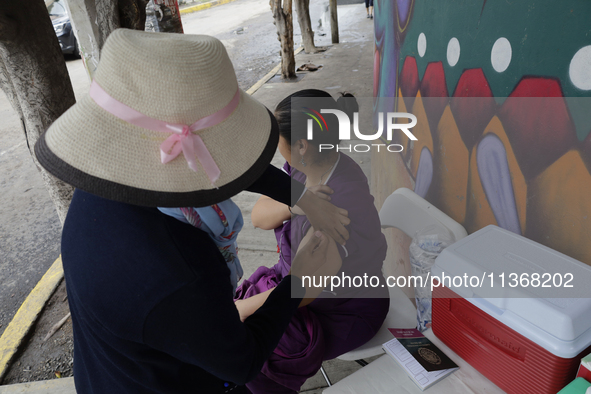 Medical staff are vaccinating people against tetanus and those who were affected after flooding in Ecatepec, State of Mexico, due to the rai...