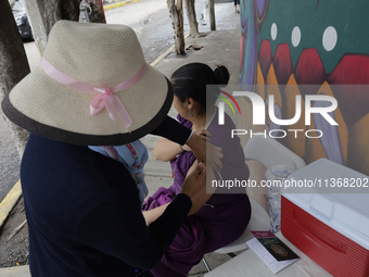 Medical staff are vaccinating people against tetanus and those who were affected after flooding in Ecatepec, State of Mexico, due to the rai...