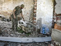 An aerial reconnaissance man of the 148th separate artillery brigade of the Ukrainian Air Assault Forces is assembling a drone before launch...