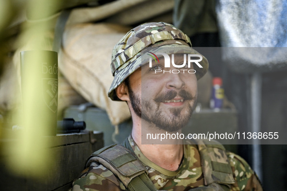 An aerial reconnaissance man of the 148th separate artillery brigade of the Ukrainian Air Assault Forces is posing for a picture in the Done...