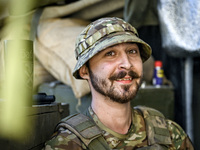 An aerial reconnaissance man of the 148th separate artillery brigade of the Ukrainian Air Assault Forces is posing for a picture in the Done...