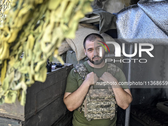 An aerial reconnaissance man of the 148th separate artillery brigade of the Ukrainian Air Assault Forces is posing for a picture in the Done...