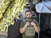 An aerial reconnaissance man of the 148th separate artillery brigade of the Ukrainian Air Assault Forces is posing for a picture in the Done...