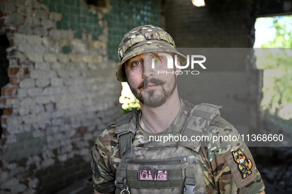 An aerial reconnaissance man of the 148th separate artillery brigade of the Ukrainian Air Assault Forces is posing for a picture in the Done...