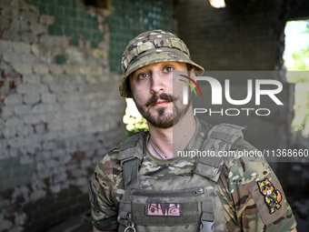 An aerial reconnaissance man of the 148th separate artillery brigade of the Ukrainian Air Assault Forces is posing for a picture in the Done...