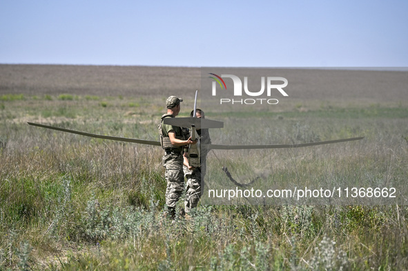 In Donetsk region, Ukraine, on June 13, 2024, aerial reconnaissance men of the 148th separate artillery brigade of the Ukrainian Air Assault...