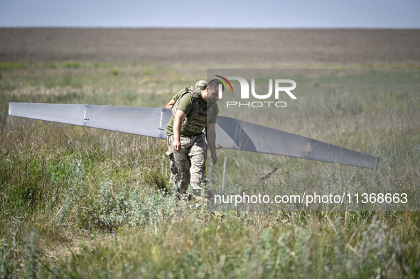 In Donetsk region, Ukraine, on June 13, 2024, aerial reconnaissance men of the 148th separate artillery brigade of the Ukrainian Air Assault...