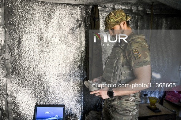 An aerial reconnaissance man of the 148th separate artillery brigade of the Ukrainian Air Assault Forces is performing combat work in Donets...