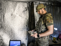 An aerial reconnaissance man of the 148th separate artillery brigade of the Ukrainian Air Assault Forces is performing combat work in Donets...