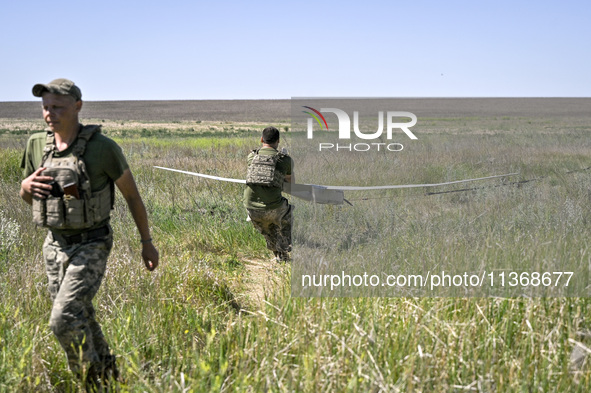 In Donetsk region, Ukraine, on June 13, 2024, aerial reconnaissance men of the 148th separate artillery brigade of the Ukrainian Air Assault...