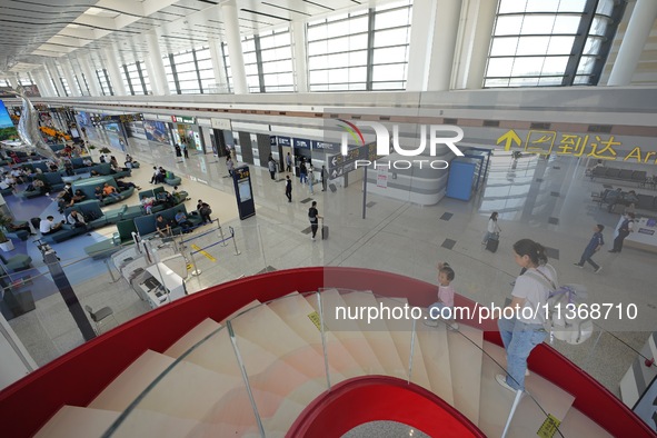 Passengers are waiting for a flight at the T2 terminal of Yantai Penglai International Airport in Yantai, China, on June 28, 2024. 