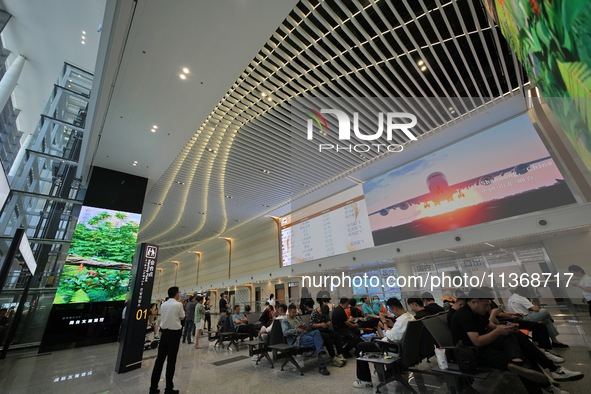 Passengers are waiting for a flight at the T2 terminal of Yantai Penglai International Airport in Yantai, China, on June 28, 2024. 