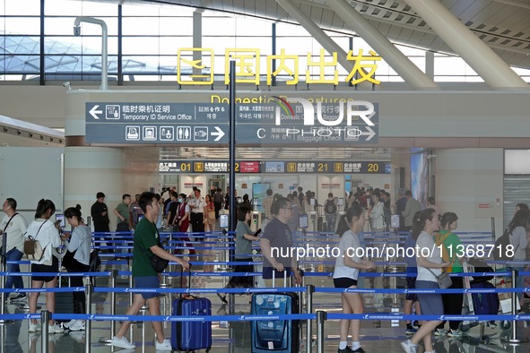 Passengers are waiting for a flight at the T2 terminal of Yantai Penglai International Airport in Yantai, China, on June 28, 2024. 