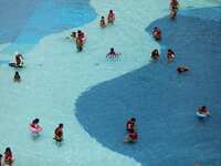 People are playing in the water at Longcheng Happy Water World Scenic spot in Chengde, China, on June 29, 2024. (