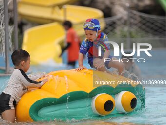 People are playing in the water at Longcheng Happy Water World Scenic spot in Chengde, China, on June 29, 2024. (