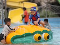 People are playing in the water at Longcheng Happy Water World Scenic spot in Chengde, China, on June 29, 2024. (