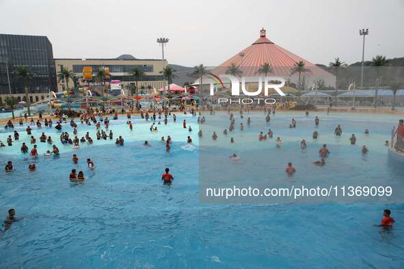 People are playing in the water at Longcheng Happy Water World Scenic spot in Chengde, China, on June 29, 2024. 