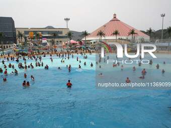 People are playing in the water at Longcheng Happy Water World Scenic spot in Chengde, China, on June 29, 2024. (