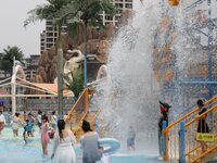 People are playing in the water at Longcheng Happy Water World Scenic spot in Chengde, China, on June 29, 2024. (