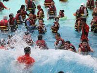 People are playing in the water at Longcheng Happy Water World Scenic spot in Chengde, China, on June 29, 2024. (