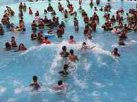 People are playing in the water at Longcheng Happy Water World Scenic spot in Chengde, China, on June 29, 2024. (