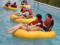 People are playing in the water at Longcheng Happy Water World Scenic spot in Chengde, China, on June 29, 2024. (