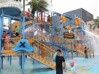 People are playing in the water at Longcheng Happy Water World Scenic spot in Chengde, China, on June 29, 2024. (