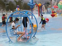 People are playing in the water at Longcheng Happy Water World Scenic spot in Chengde, China, on June 29, 2024. (