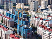 Builders are working at the construction site of a house renovation project in Baotou, Inner Mongolia, China, on June 29, 2024. (