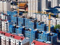 Builders are working at the construction site of a house renovation project in Baotou, Inner Mongolia, China, on June 29, 2024. (