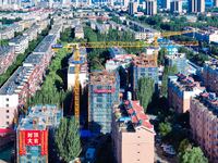 Builders are working at the construction site of a house renovation project in Baotou, Inner Mongolia, China, on June 29, 2024. (