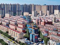 Builders are working at the construction site of a house renovation project in Baotou, Inner Mongolia, China, on June 29, 2024. (