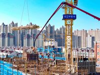 Builders are working at the construction site of a house renovation project in Baotou, Inner Mongolia, China, on June 29, 2024. (