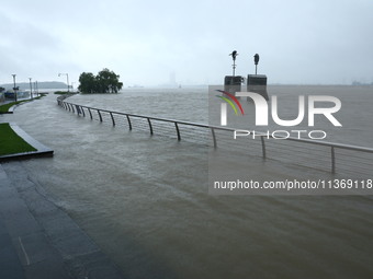 The Nanjing section of the Yangtze River is exceeding the warning water level in Nanjing, China, on June 29, 2024. (