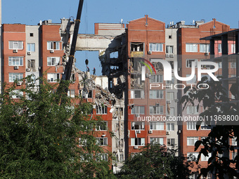 Rescuers are carrying out a search and rescue effort at the apartment block hit by the Russian missile in Dnipro, Ukraine, on June 29, 2024....