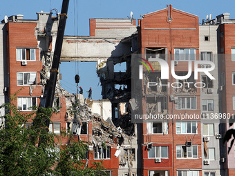 Rescuers are carrying out a search and rescue effort at the apartment block hit by the Russian missile in Dnipro, Ukraine, on June 29, 2024....