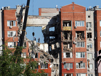 Rescuers are carrying out a search and rescue effort at the apartment block hit by the Russian missile in Dnipro, Ukraine, on June 29, 2024....