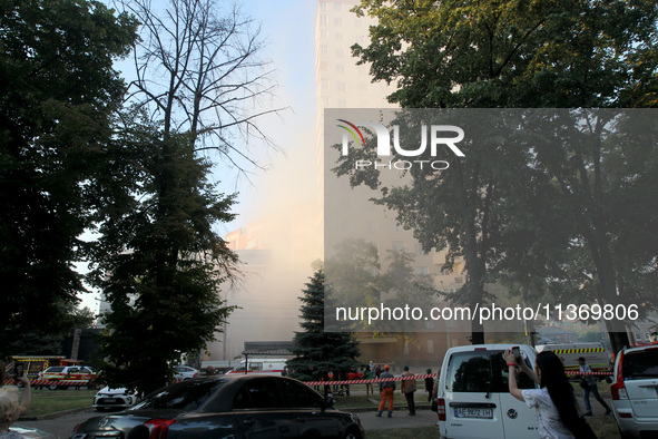 Dust is shrouding an apartment block hit by a Russian missile in Dnipro, Ukraine, on June 28, 2024. Russian troops are attacking a residenti...