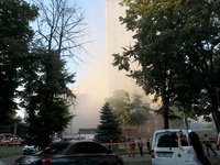 Dust is shrouding an apartment block hit by a Russian missile in Dnipro, Ukraine, on June 28, 2024. Russian troops are attacking a residenti...