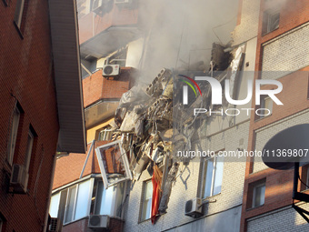 An apartment block is being pictured after it was hit by a Russian missile in Dnipro, Ukraine, on June 28, 2024. Russian troops are attackin...