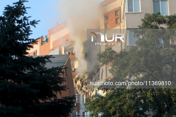 An apartment block is being pictured after it was hit by a Russian missile in Dnipro, Ukraine, on June 28, 2024. Russian troops are attackin...