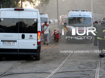 Ambulances are being pictured during a search and rescue effort at an apartment block hit by a Russian missile in Dnipro, Ukraine, on June 2...