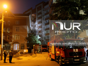 A fire engine is parking outside an apartment block hit by a Russian missile in Dnipro, Ukraine, on June 28, 2024. Russian troops are attack...