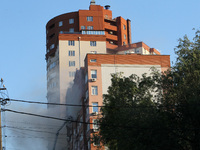 An apartment block is being pictured after it was hit by a Russian missile in Dnipro, Ukraine, on June 28, 2024. Russian troops are attackin...