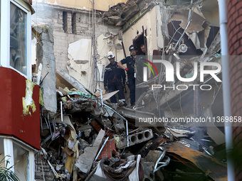 Rescuers are carrying out a search and rescue effort at an apartment block damaged by the June 28 Russian missile attack in Dnipro, Ukraine,...